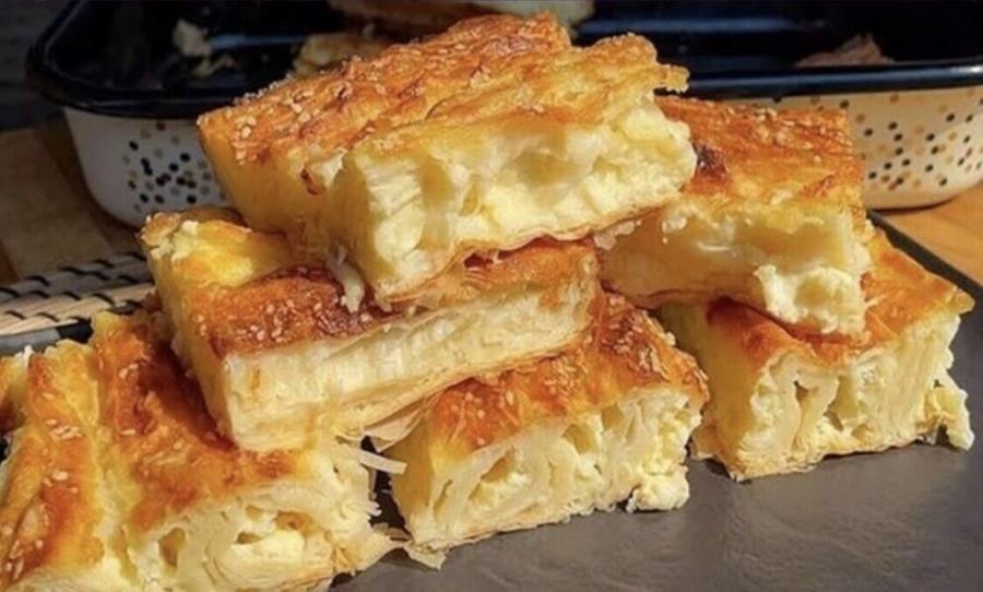 Πίτα με γιαούρτι και τυρί: Εύκολη “αρμόνικα” συνταγή αφράτη και ζουμερή