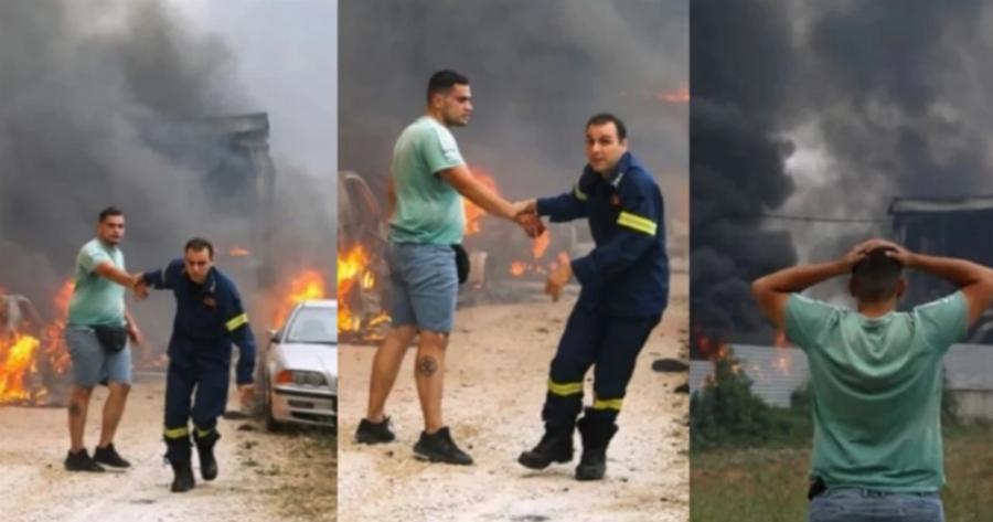 Πυροσβέστης παίρνει σηκωτό ιδιοκτήτη μάντρας αυτοκινήτων που τυλίγεται στις φλόγες