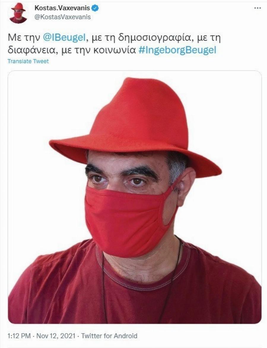 Κώστας Βαξεβάνης: Έβαλε κόκκινο καπέλο και κόκκινη μάσκα και δηλώνει υποστήριξη στην Ολλανδή δημοσιογράφο