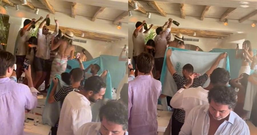 Πρωτόγνωρες εικόνες: Δείτε πως οι σερβιτόροι του Nammos προστατεύουν τους πελάτες από τα μπουγέλα με τις σαμπάνιες στη Μύκονο