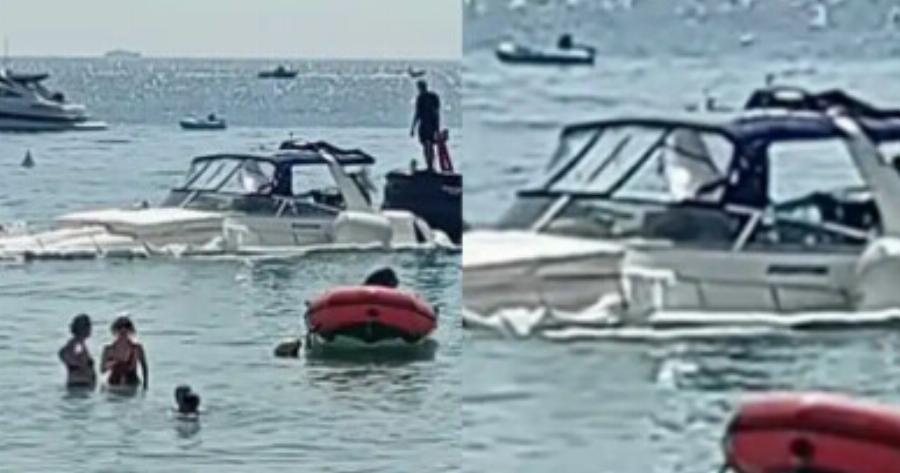 Σκάφος βυθίζεται δίπλα σε λουόμενους σε παραλία της Βουλιαγμένης – Bίντεο